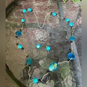 Turquoise blue plastic and silver metal costume necklace and pendant earrings